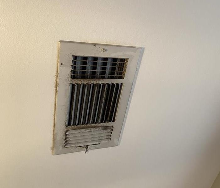 AC vent that has been collecting dirt and needs to be cleaned