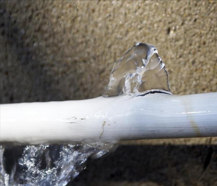 white pipe burst leaking water